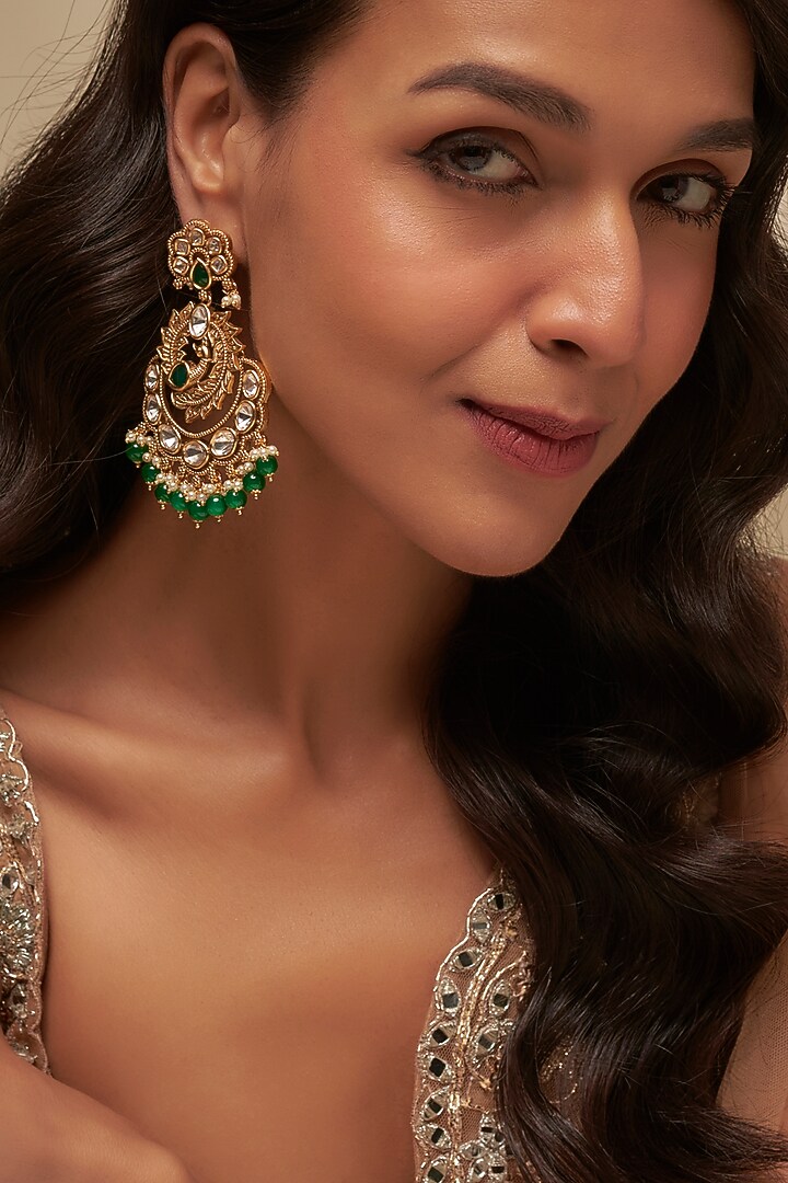 Gold Finish Uncut Zircon & Emerald Dangler Earrings by Aryah Jewels at Pernia's Pop Up Shop