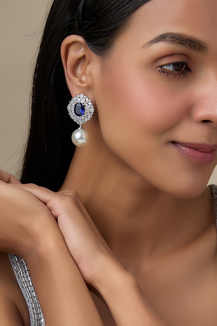 White Rhodium Finish Blue Stone & Diamond Dangler Earrings by Aryah Jewels at Pernia's Pop Up Shop