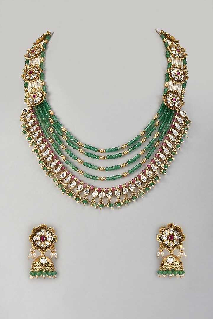 Gold Finish Emerald Beaded & Motif Layered Necklace Set by Aryah Jewels at Pernia's Pop Up Shop