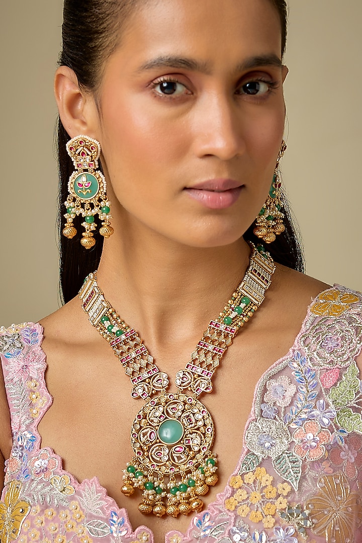Gold Finish Emerald Stone & Uncut Zircon Pendant Necklace Set by Aryah Jewels at Pernia's Pop Up Shop