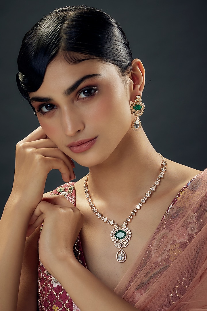 Gold Finish Uncut Zircon & Synthetic Emerald Stone Pendant Necklace Set by Aryah Jewels at Pernia's Pop Up Shop