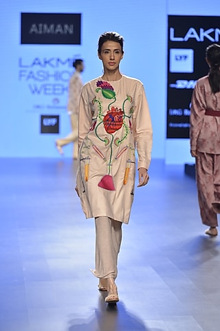 Nude laboratory embroidered motif cutout tunic by Aiman