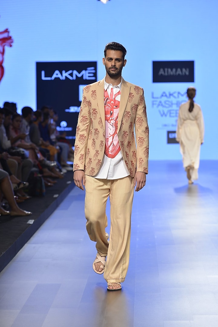 Nude heart embroidered mens coat by Aiman