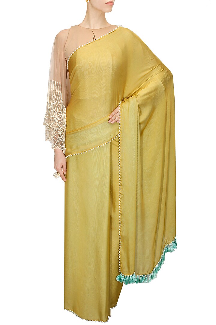 Mustard and mint blue two way sari with nude blouse available only at Pernia's Pop-Up Shop.