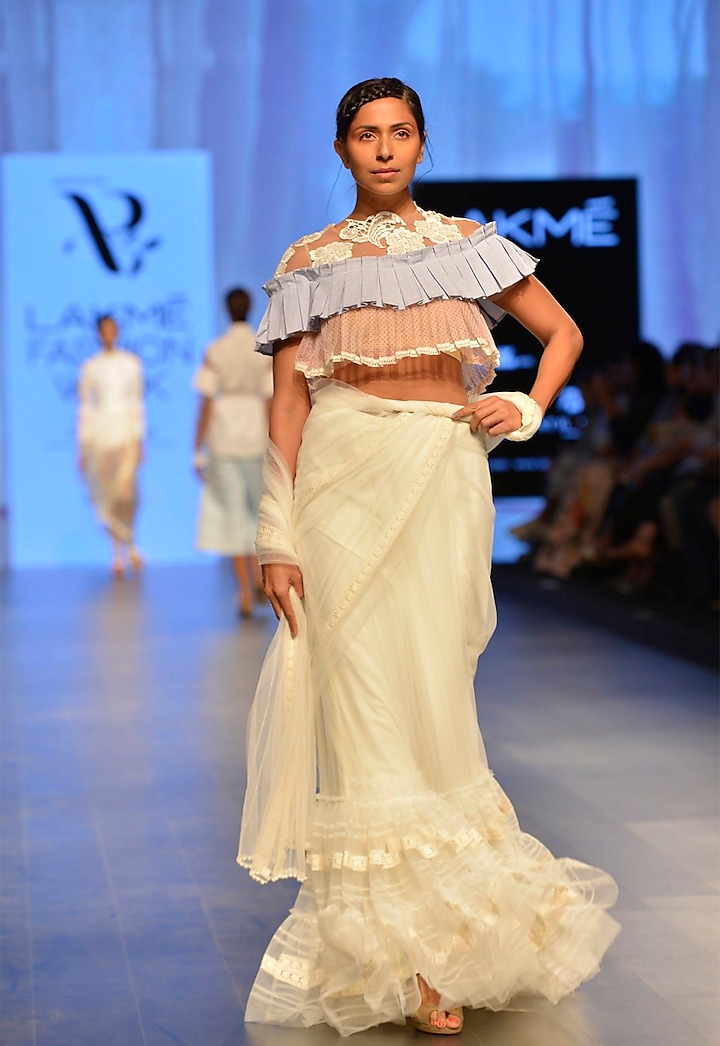 White ruffle border saree by Archana Rao