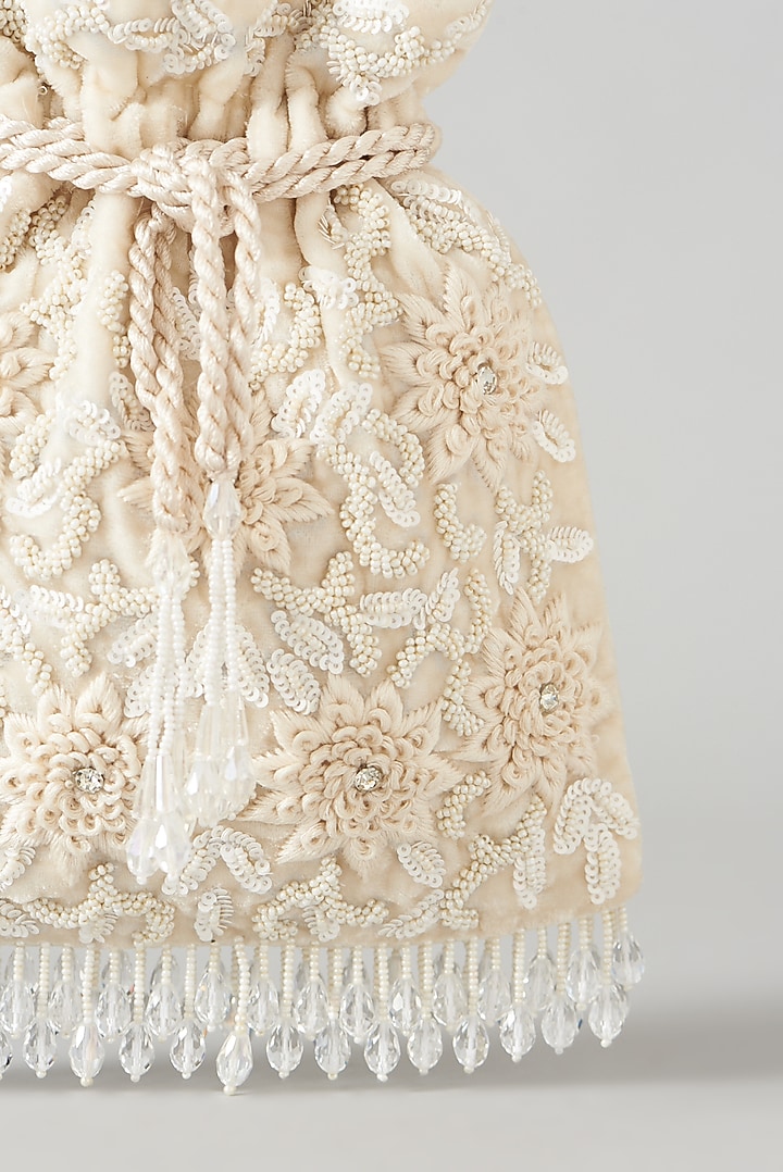 Ivory Velvet Embroidered Potli Bag by Aanchal Sayal at Pernia's Pop Up Shop