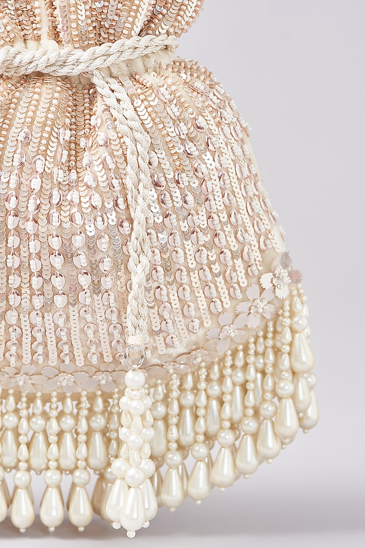 Ivory Velvet Sequins Embroidered Potli by Aanchal Sayal at Pernia's Pop Up Shop