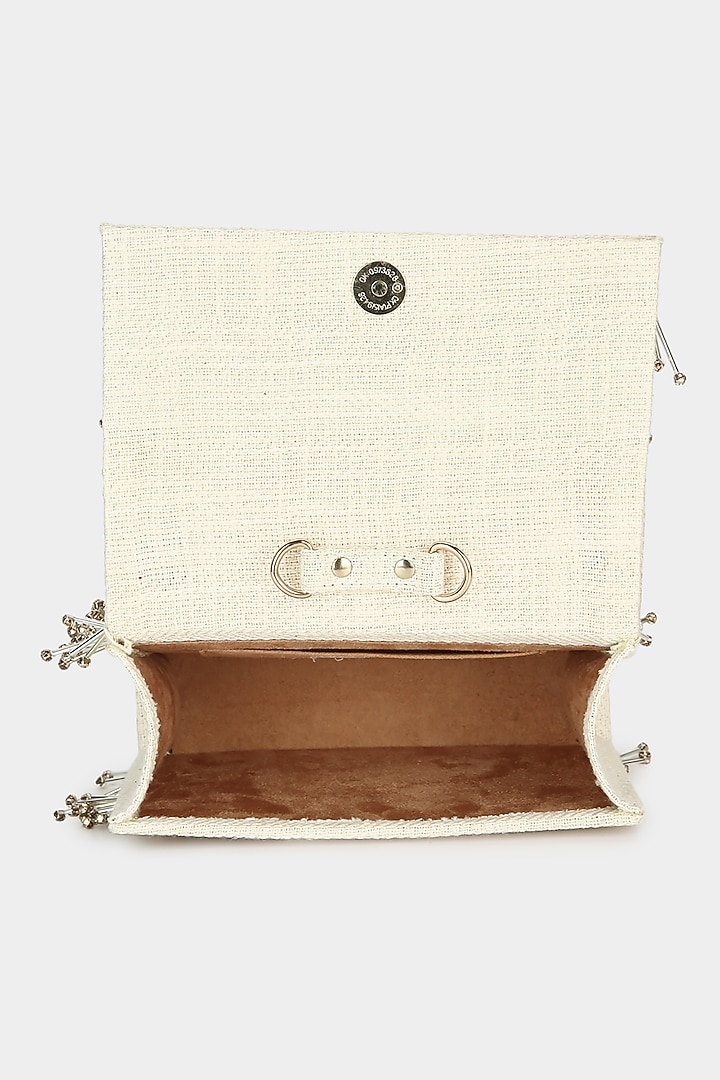 Ivory Embellished Textured Mini Bag by Aanchal Sayal at Pernia's Pop Up Shop