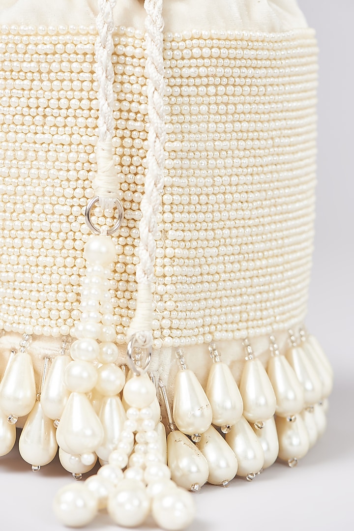 Ivory Velvet Pearl Hand Embroidered Structured Bucket Bag by Aanchal Sayal at Pernia's Pop Up Shop