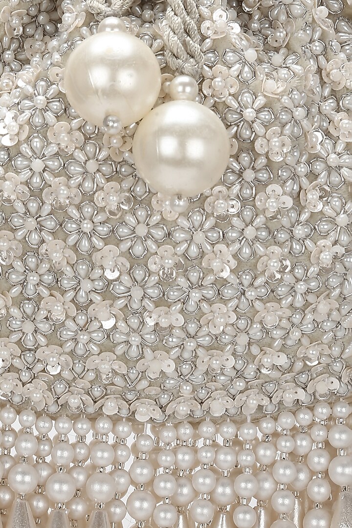 Ivory Velvet Embroidered Potli by Aanchal Sayal at Pernia's Pop Up Shop