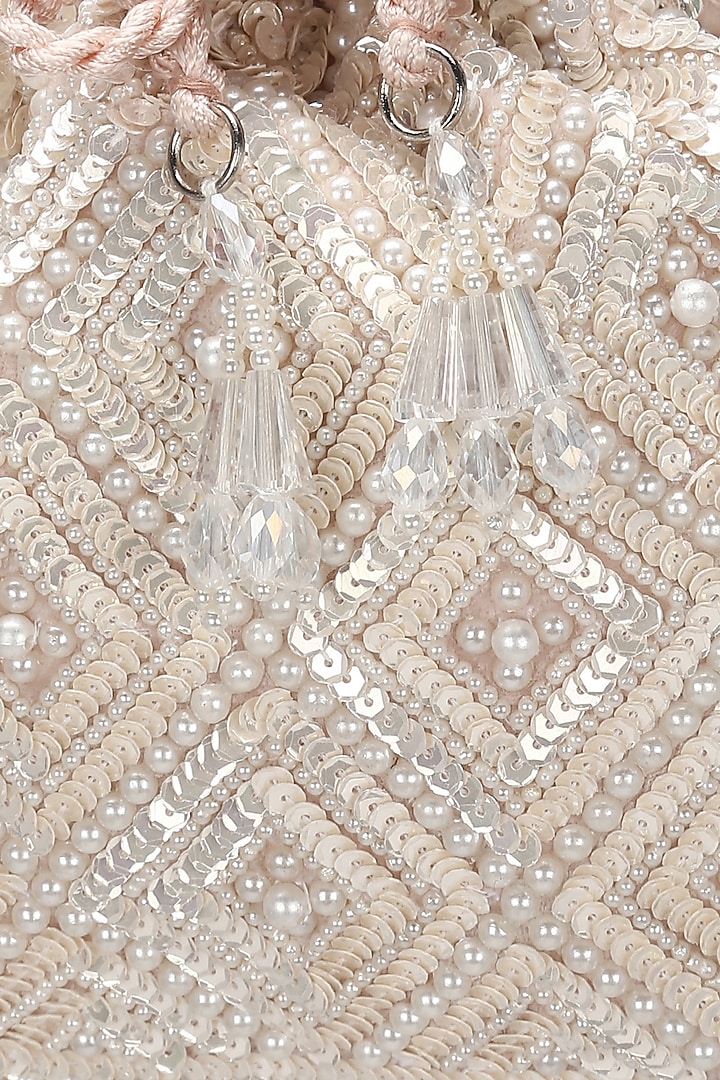 Ivory & Baby Pink Embroidered Potli by Aanchal Sayal at Pernia's Pop Up Shop