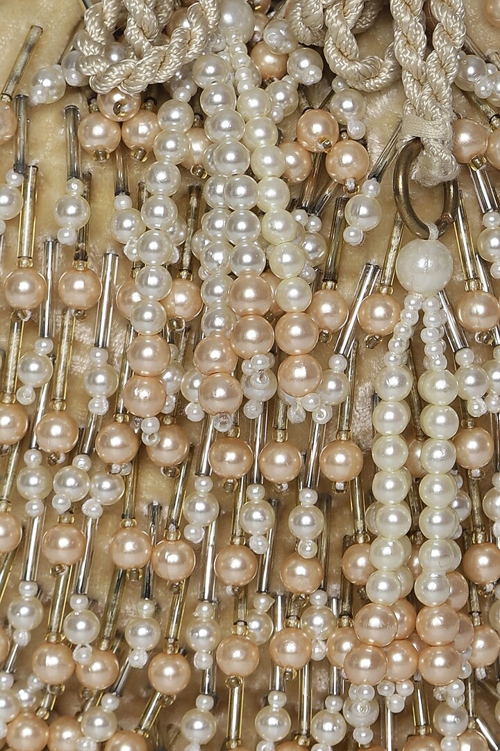 Beige Potli Bucket Bag With Small Pearl Tassels by Aanchal Sayal at Pernia's Pop Up Shop