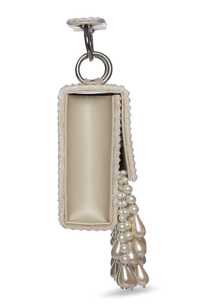 Ivory Faux Leather Mini Bag by Aanchal Sayal at Pernia's Pop Up Shop