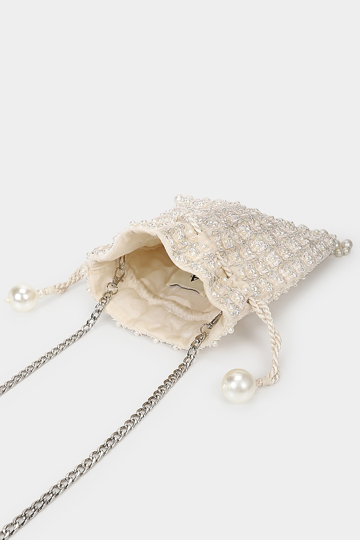 Ivory Velvet Embroidered Potli by Aanchal Sayal at Pernia's Pop Up Shop