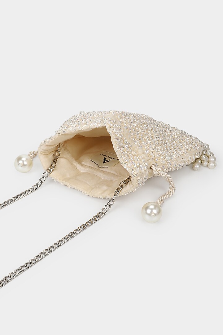 Ivory Velvet Sequins Embroidered Potli by Aanchal Sayal at Pernia's Pop Up Shop