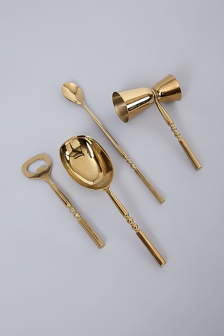 Gold PVD Coated & Steel Twisted Bar Set Of 4 by Assemblage at Pernia's Pop Up Shop