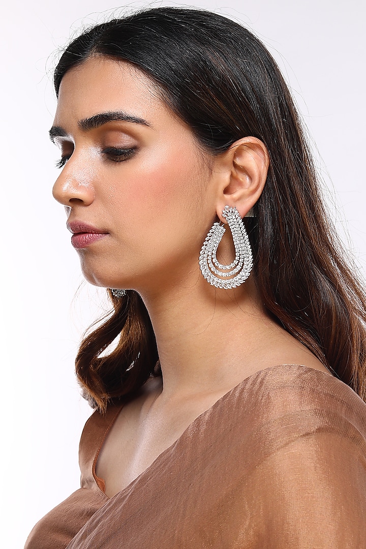 White Finish Faux Diamond Earrings by Aster
