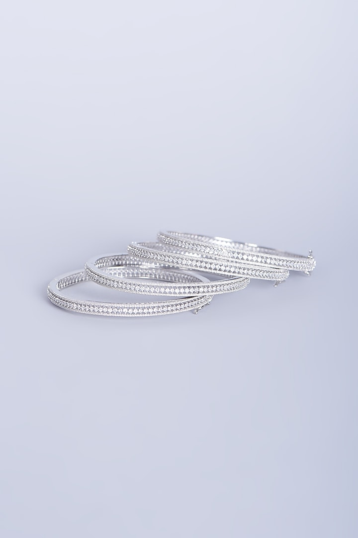 White Finish Zircons Bangles In Mixed Metal (Set of 4) by Aster at Pernia's Pop Up Shop