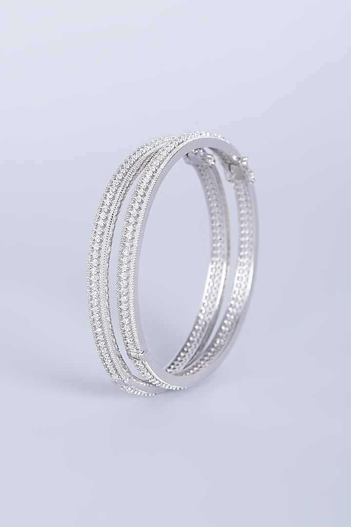White Finish Zircons Bangles In Mixed Metal (Set of 4) by Aster at Pernia's Pop Up Shop