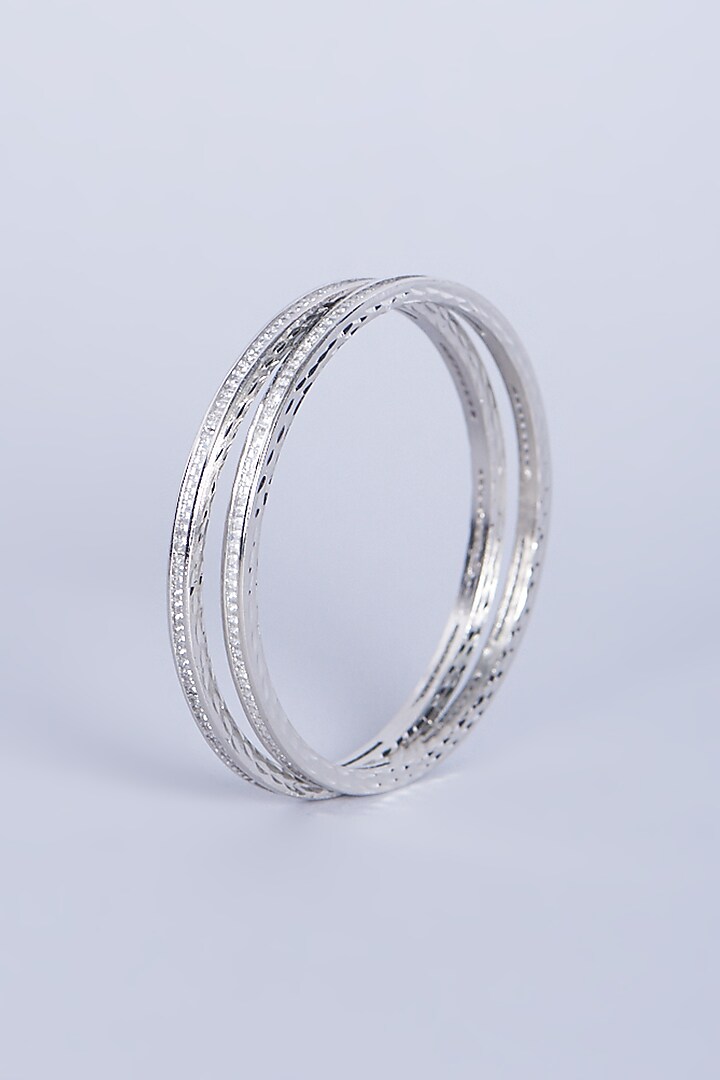 White Finish Mixed Metal Faux Diamonds Bangles (Set of 4) by Aster at Pernia's Pop Up Shop