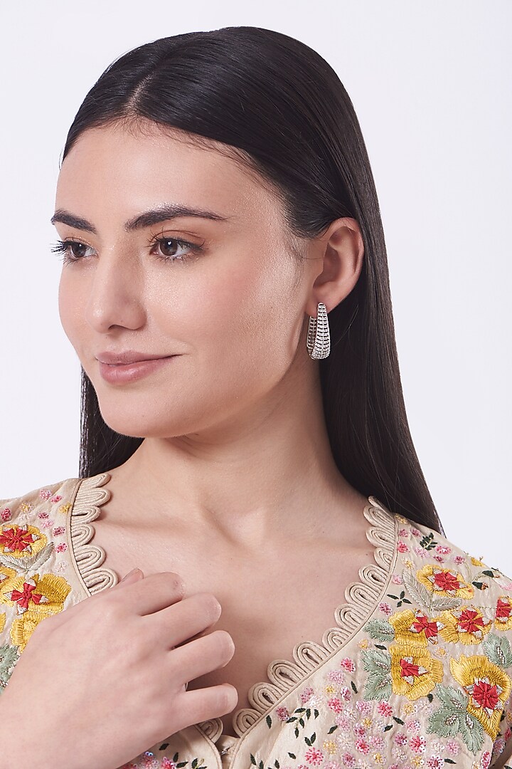 White Finish Zircons & Faux Diamonds Hoop Earrings by Aster at Pernia's Pop Up Shop