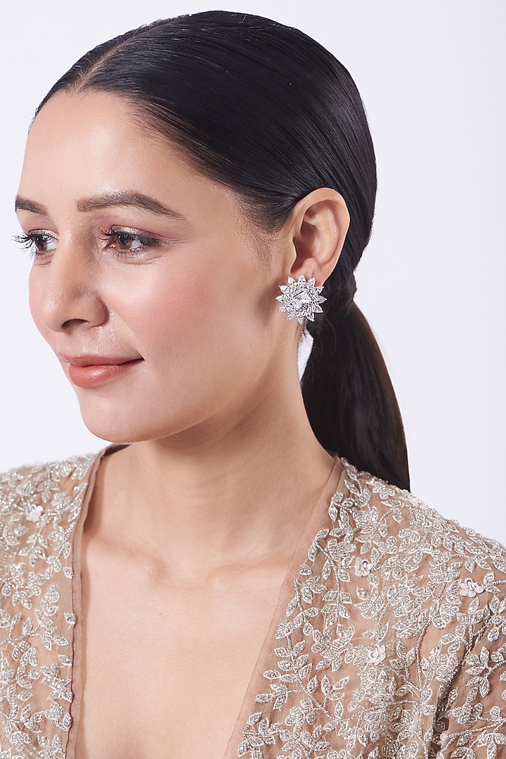 White Finish Faux Diamonds Stud Earrings In Mixed Metal by Aster at Pernia's Pop Up Shop
