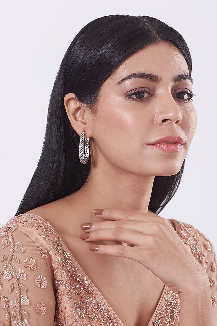 White Finish Faux Diamond Hoop Earrings by Aster at Pernia's Pop Up Shop