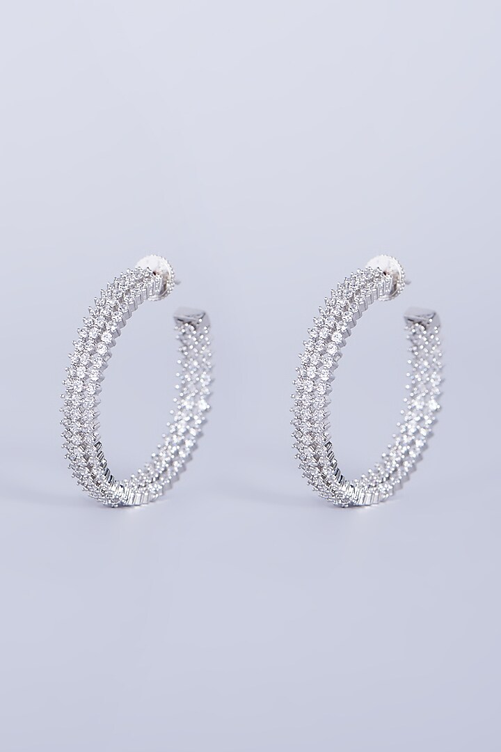 White Finish Mixed Metal Hoop Earrings With Faux Diamonds by Aster at Pernia's Pop Up Shop