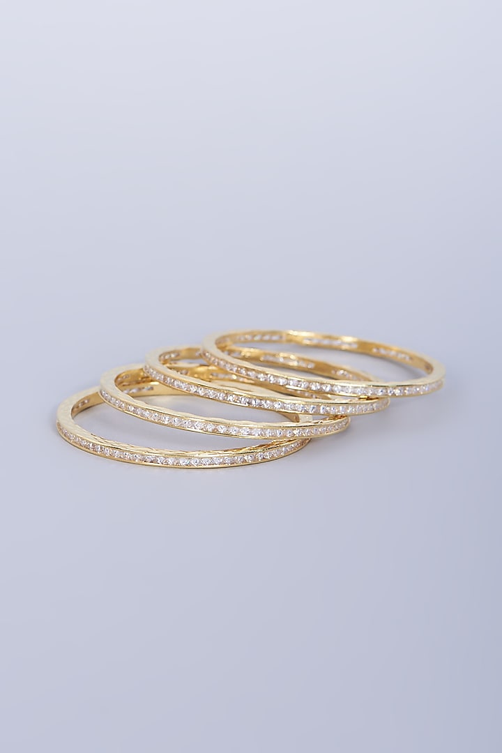 Gold Finish Faux Diamond Bangles (Set of 4) by Aster at Pernia's Pop Up Shop