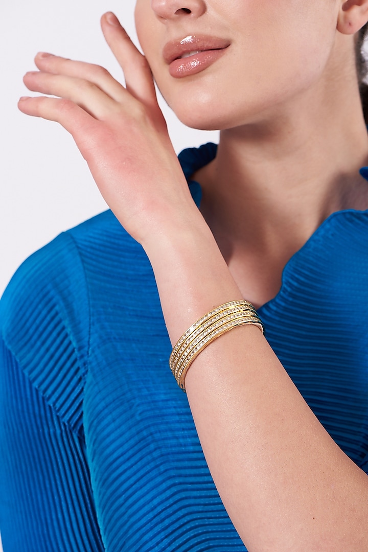 Gold Finish Faux Diamond Bangles (Set of 4) by Aster at Pernia's Pop Up Shop