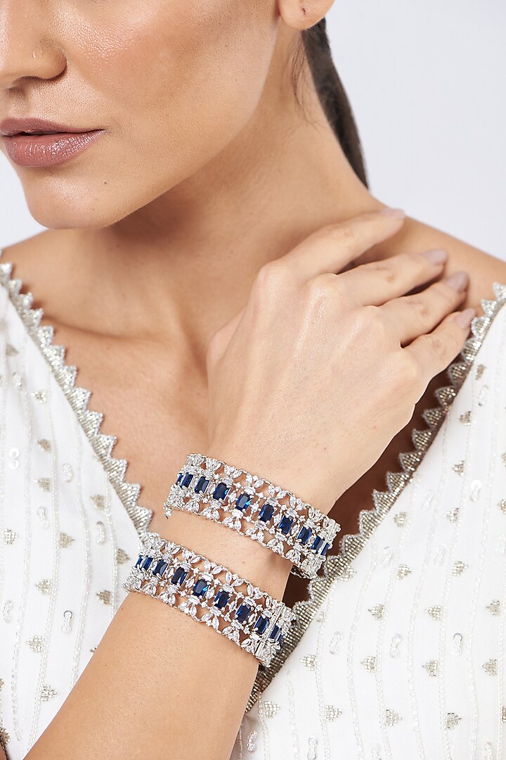 White Finish Blue Synthetic Stone Bangles (Set of 2) by Aster at Pernia's Pop Up Shop