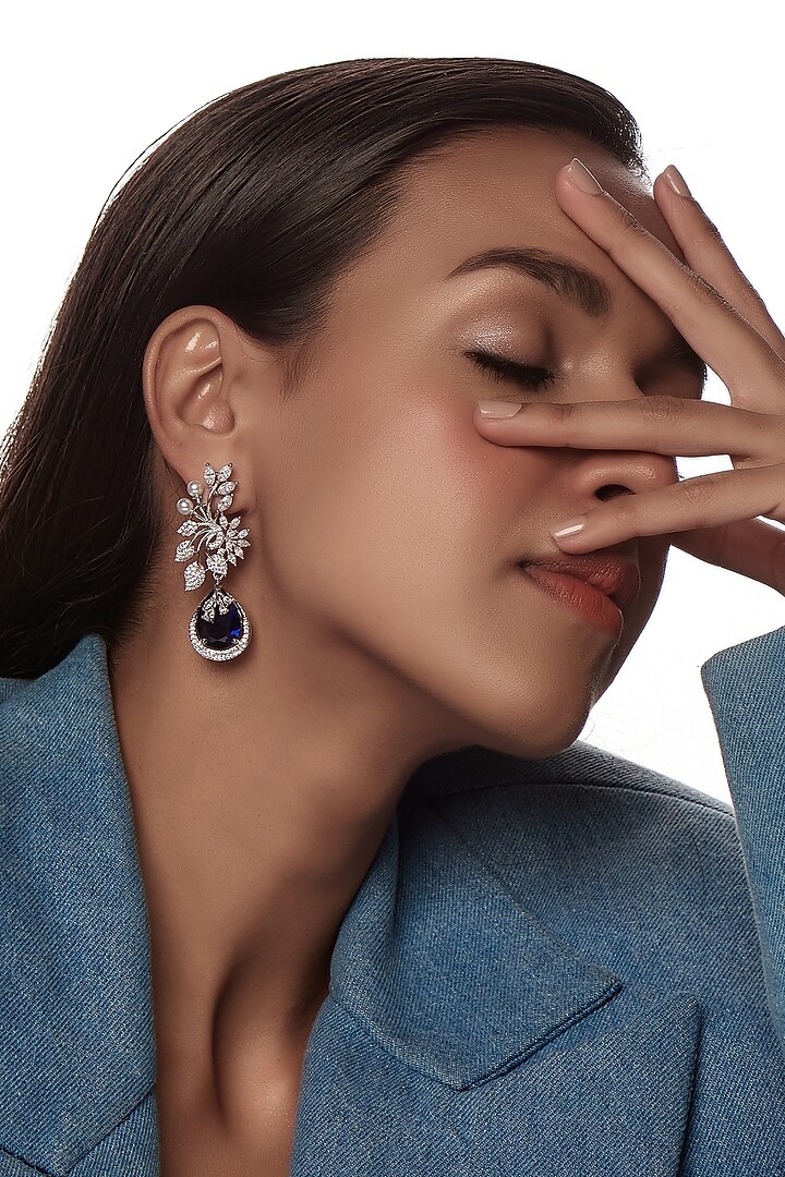 White Finish Zircon & Blue Stone Dangler Earrings by Aster at Pernia's Pop Up Shop