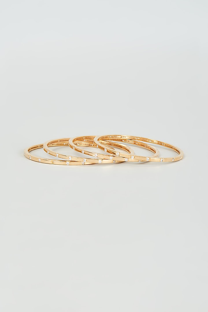 Gold Finish Faux Diamond Bangles (Set Of 4) by Aster at Pernia's Pop Up Shop