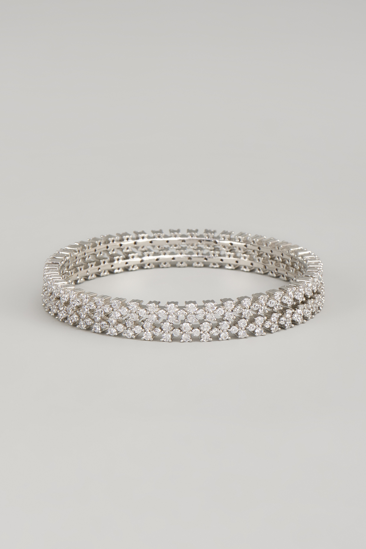 White Finish Zircon Bangles (Set Of 2) by Aster at Pernia's Pop Up Shop