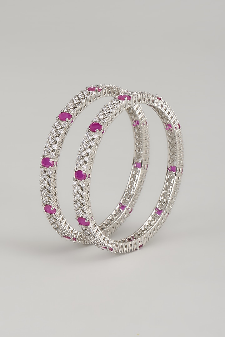 White Finish Zircon & Red Stone Bangles (Set Of 2) by Aster at Pernia's Pop Up Shop