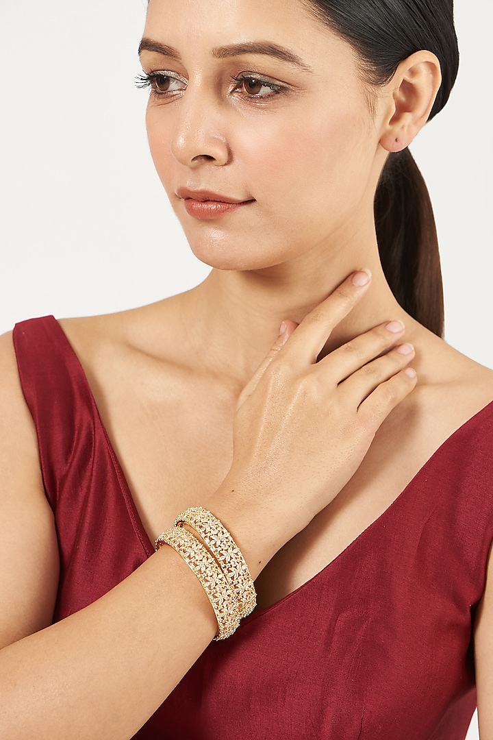 Gold Finish Zircon & Faux Diamond Bangles (Set of 2) by Aster at Pernia's Pop Up Shop