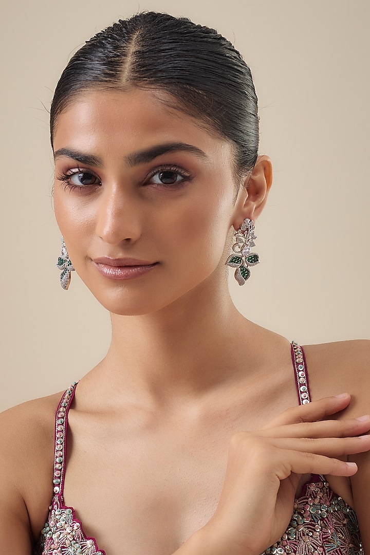 White Finish Zircon & Emerald Stone Dangler Earrings by Aster at Pernia's Pop Up Shop