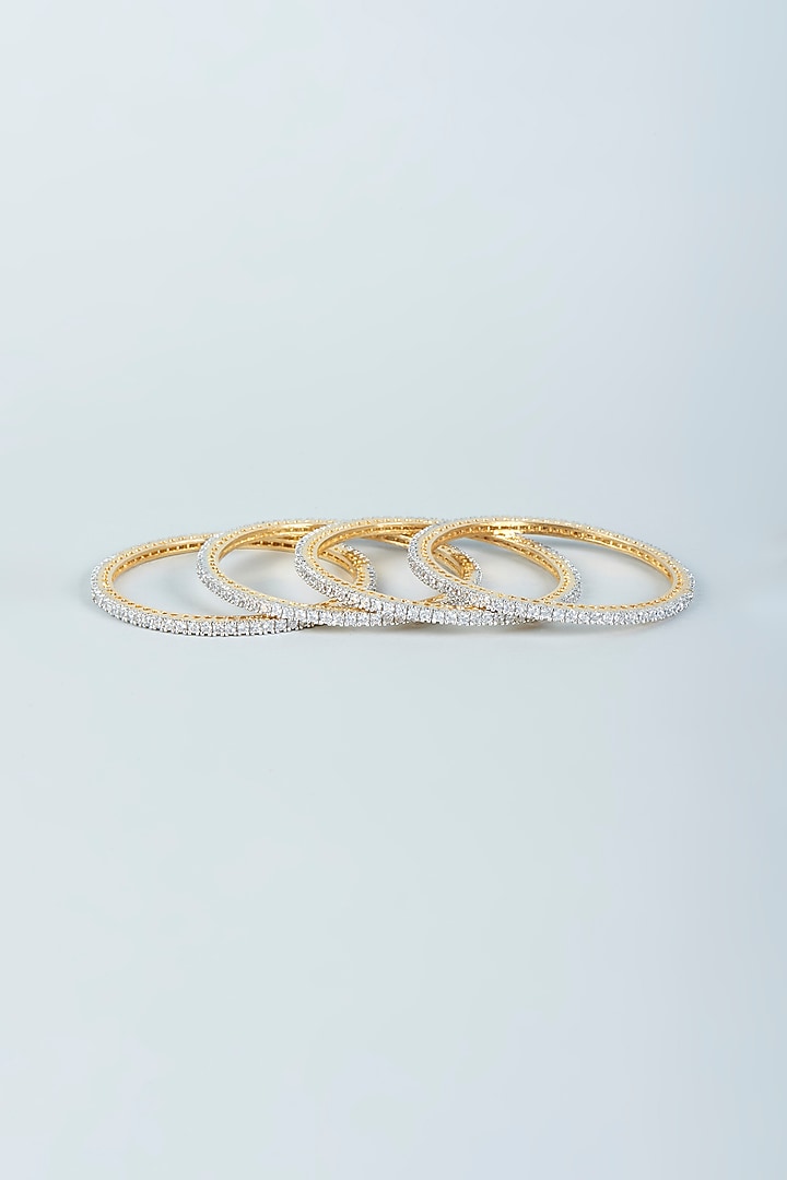 Gold Finish Zircon Bangles (Set of 4) by Aster at Pernia's Pop Up Shop