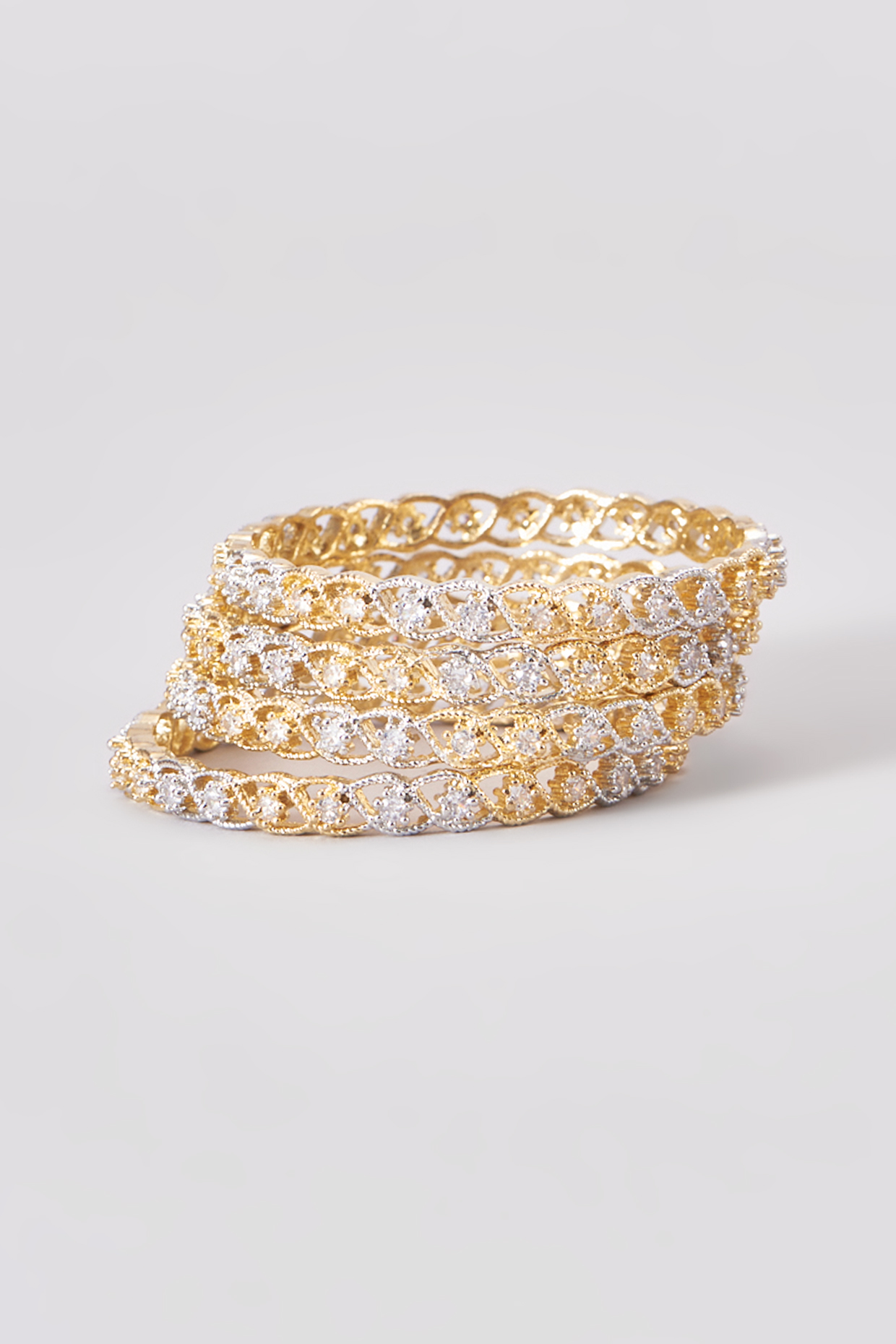 Gold Finish Zircon Bangles (Set of 4) by Aster at Pernia's Pop Up Shop