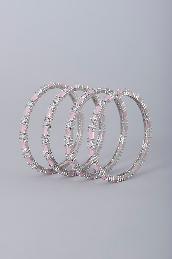 White Finish Faux Diamonds & Pink Synthetic Stones Bangles (Set Of 4) by Aster at Pernia's Pop Up Shop