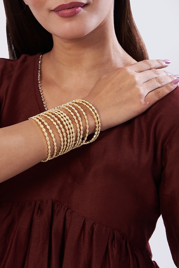 Gold Finish Zircon Bangles (Set of 12) by Aster at Pernia's Pop Up Shop