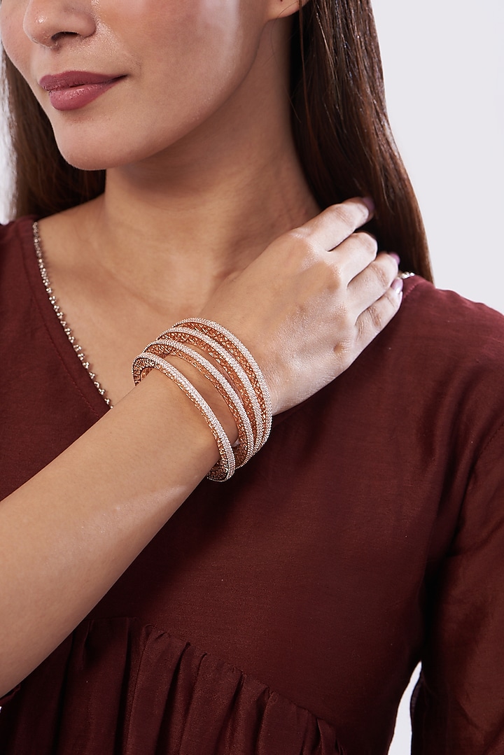 Rose Gold Finish Zircon Bangles (Set of 4) by Aster at Pernia's Pop Up Shop