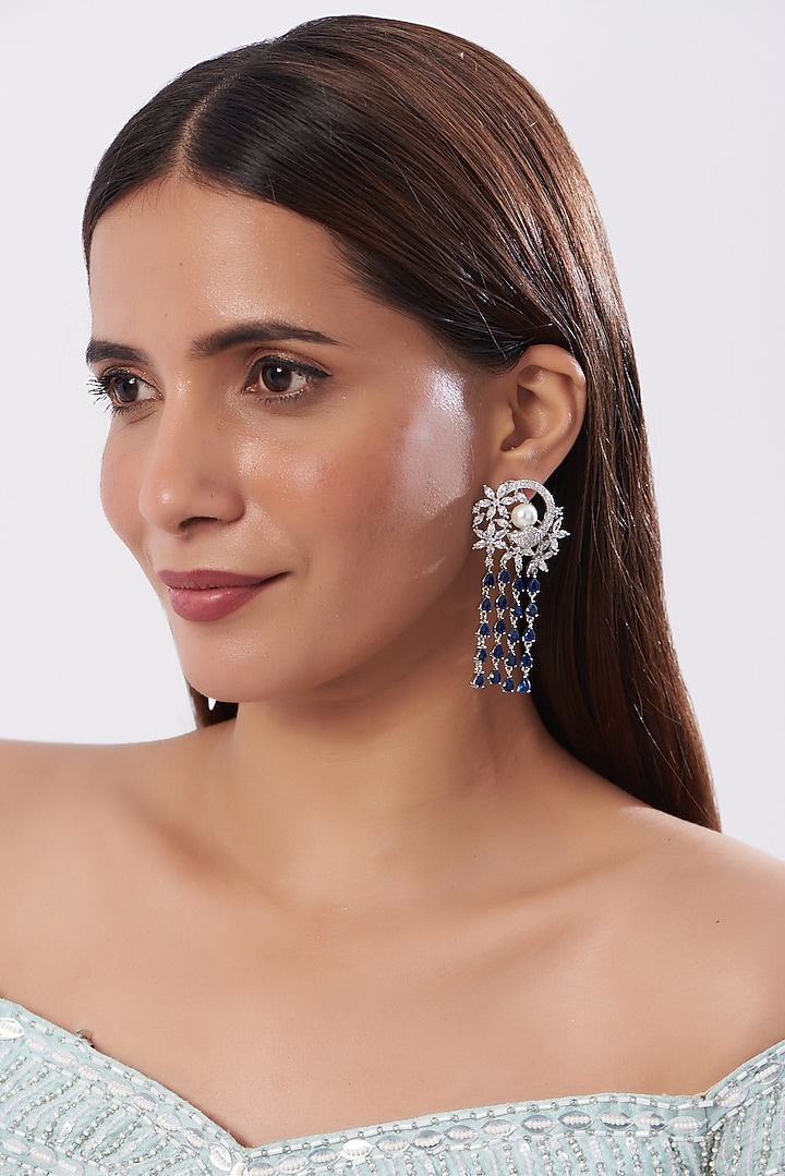 White Finish Zircon & Blue Stone Dangler Earrings by Aster at Pernia's Pop Up Shop
