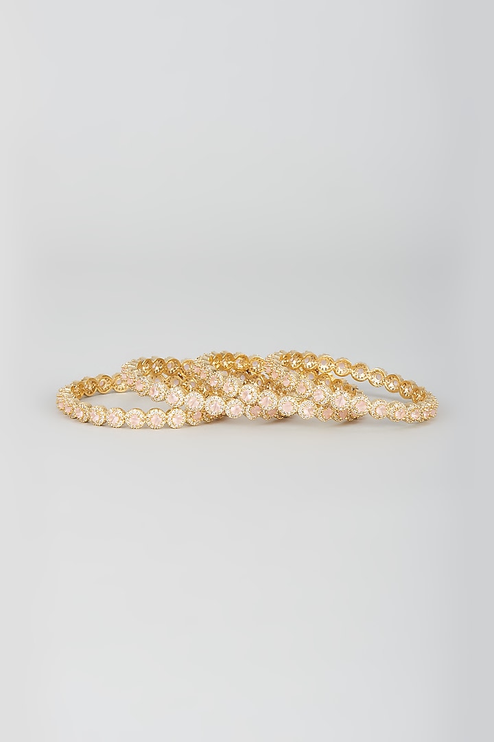 Gold Finish Zircon & Pink Stone Bangles (Set of 4) by Aster at Pernia's Pop Up Shop