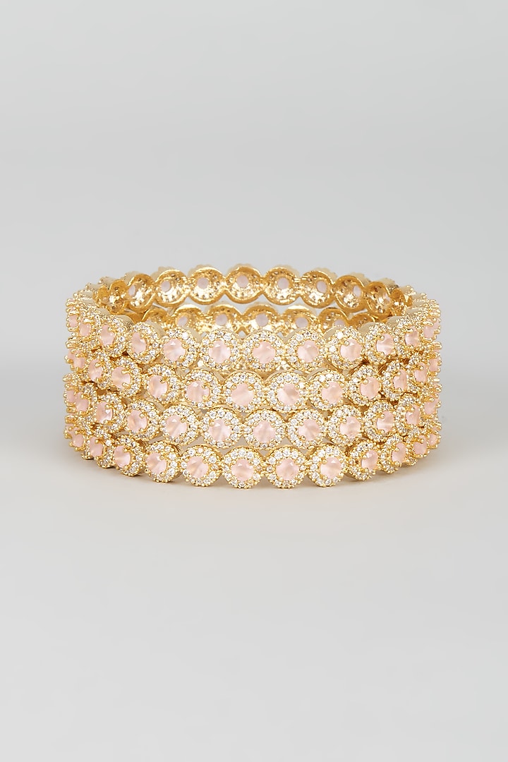 Gold Finish Zircon & Pink Stone Bangles (Set of 4) by Aster at Pernia's Pop Up Shop
