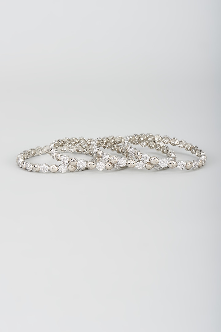 White Finish Zircon Bangles (Set of 4) by Aster at Pernia's Pop Up Shop
