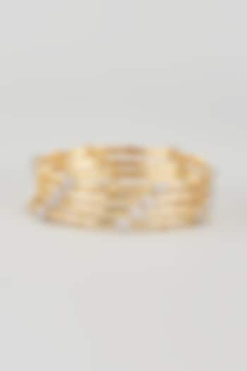 Gold Finish Zircon Bangles (Set of 4) by Aster at Pernia's Pop Up Shop