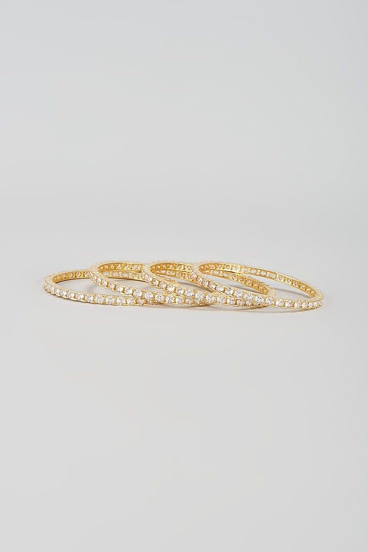 Gold Finish Zircon Bangles (Set of 4) by Aster at Pernia's Pop Up Shop