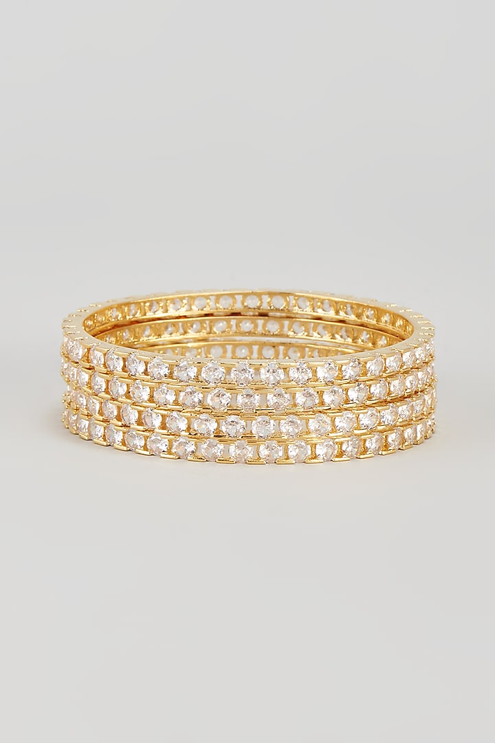 Gold Finish Zircon Bangles (Set of 4) by Aster at Pernia's Pop Up Shop
