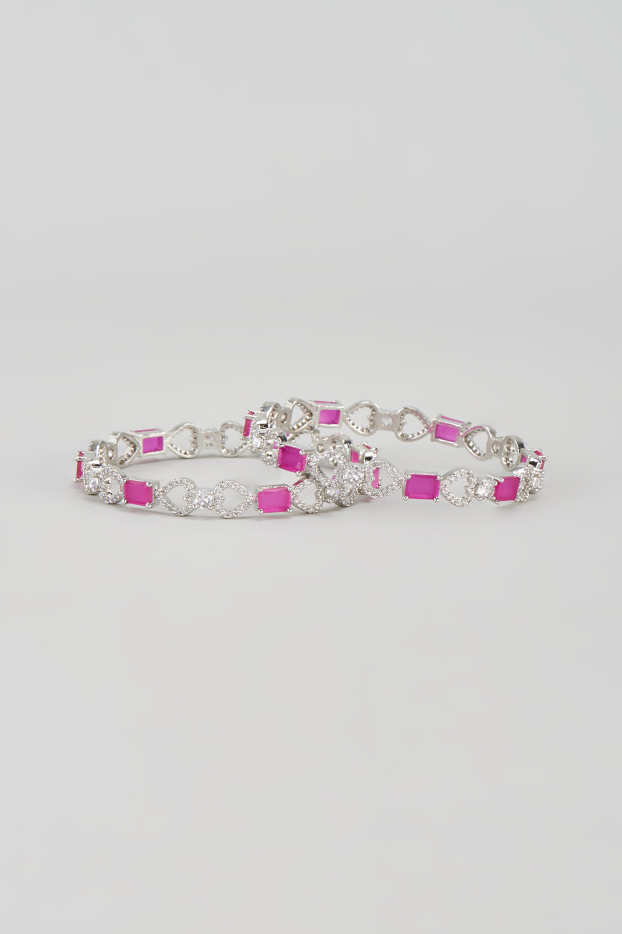 White Finish Zircon & Red Stone Bangles (Set of 2) by Aster at Pernia's Pop Up Shop